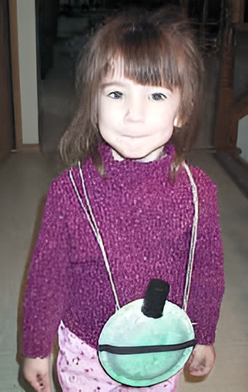 photo of the finished paper plate canteen craft worn by a preschool girl