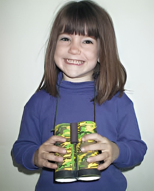 photo of the finished camoflauge binoculars craft, held by a preschool girl