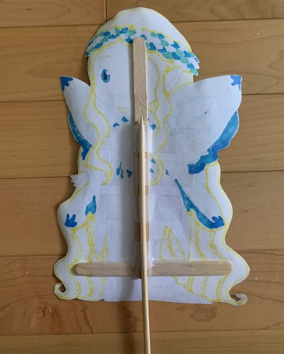 titania puppet taped to sticks